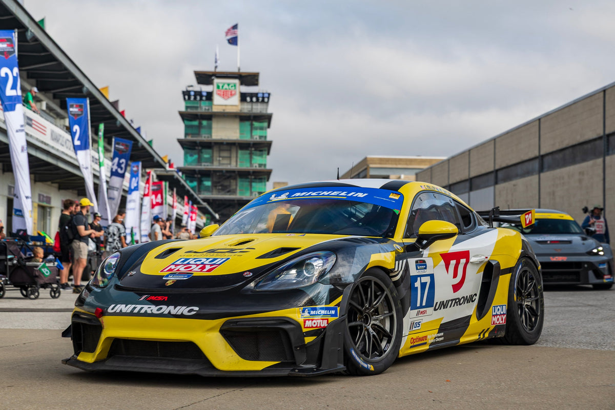 OptiMate battery charger maintaining a supercar or race car in a performance garage