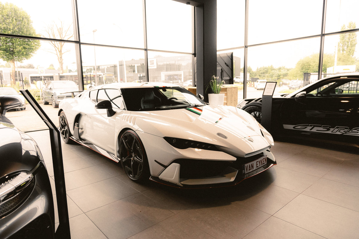 OptiMate battery charger maintaining a supercar or race car in a performance garage